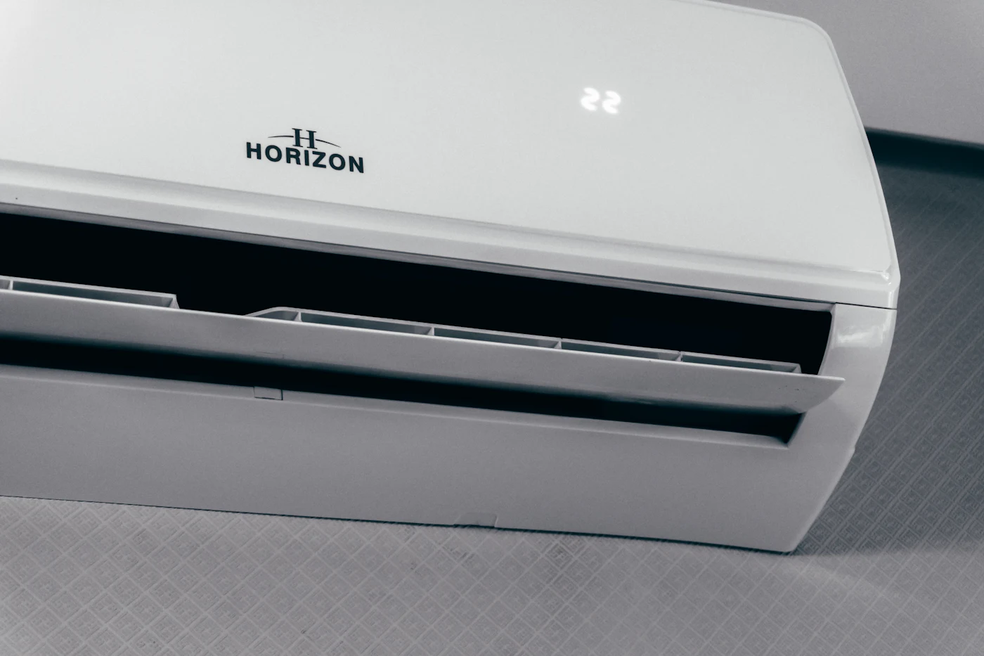 Wall-mounted air conditioning unit showing 22 degrees