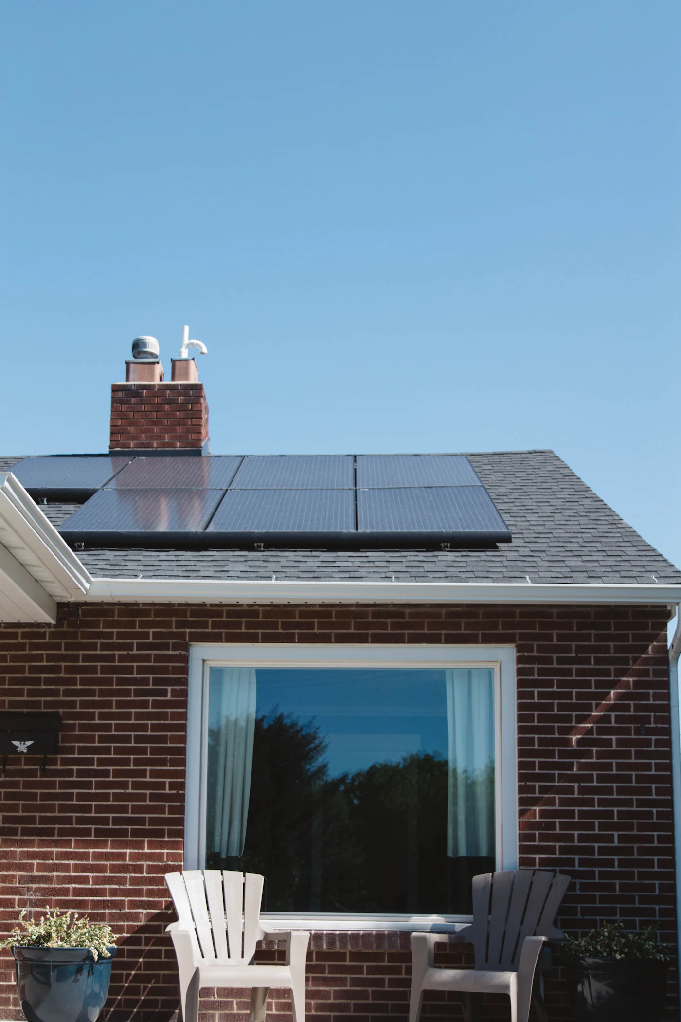 Brick house with solar panels on the roof